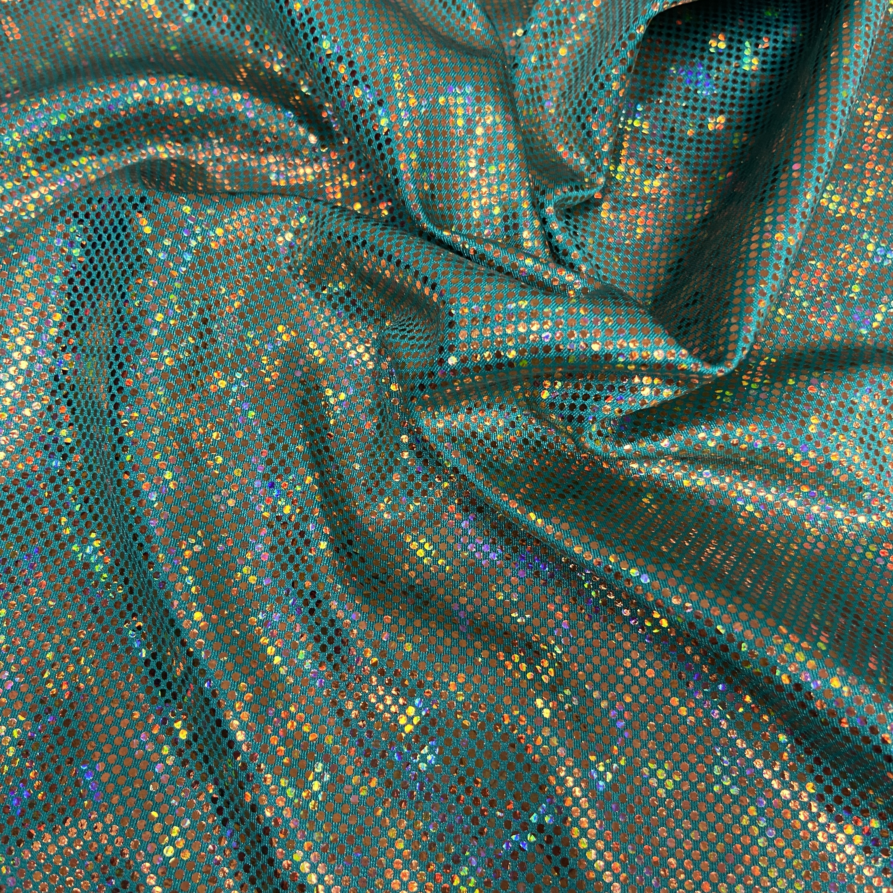 Gold shattered hologram on seafoam