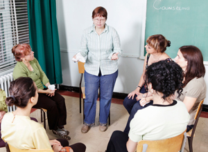 Group of people taking counselling from counselor