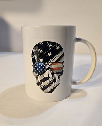 15oz ceramic mug featuring a USA flag skull design