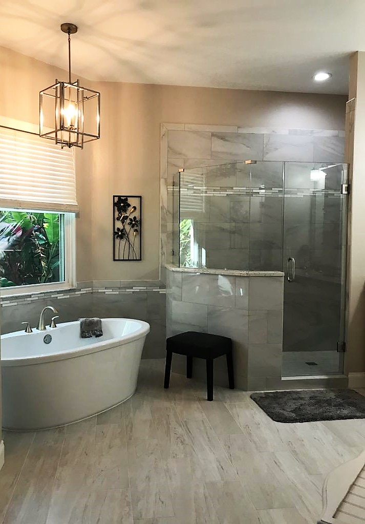 Timeless bathroom featuring stand alone tub and large separate walk-in shower.
