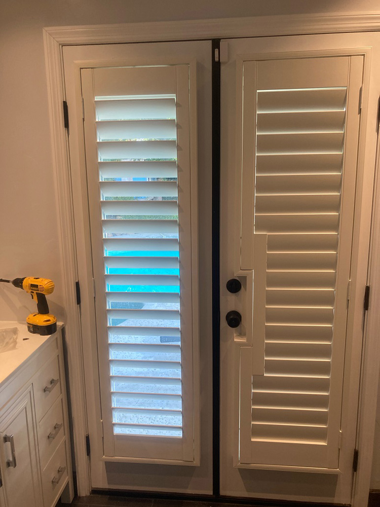 Two panel rest room application 3 1/2 louver clear view shutters