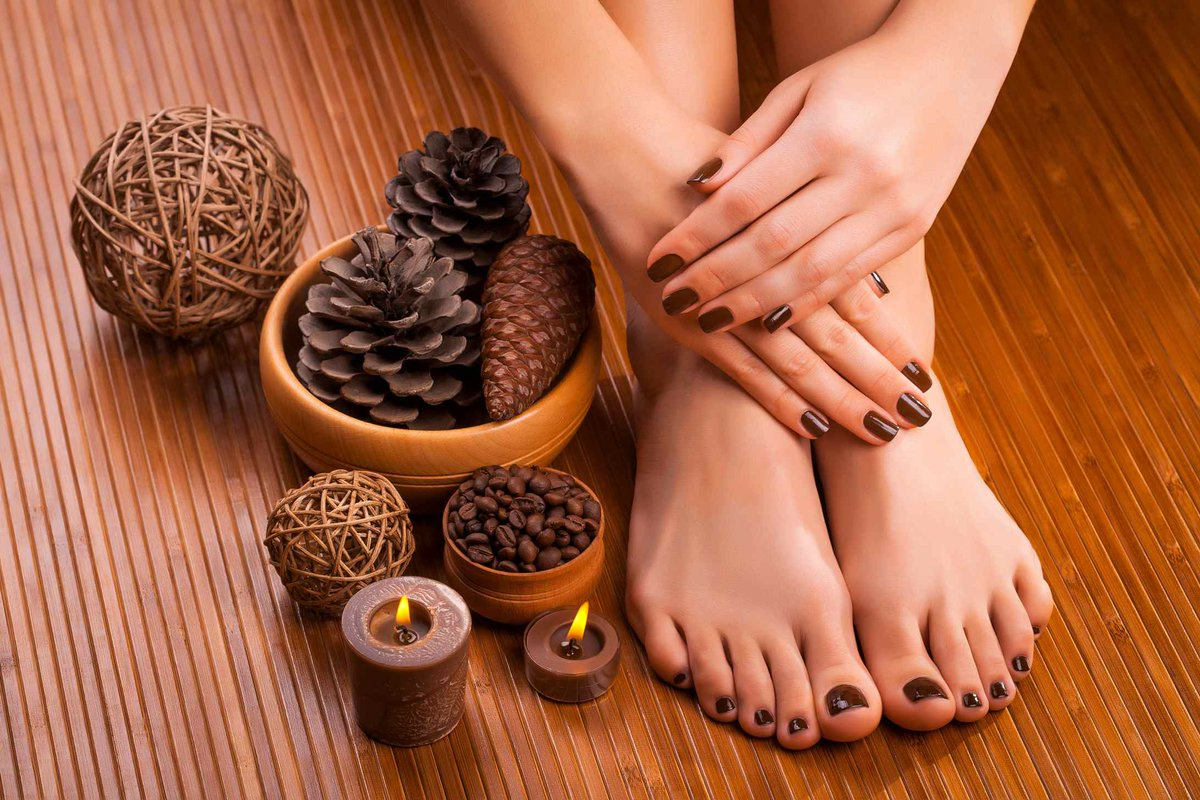 Woman lying with spa stones on her back Woman lying with spa stones on her back