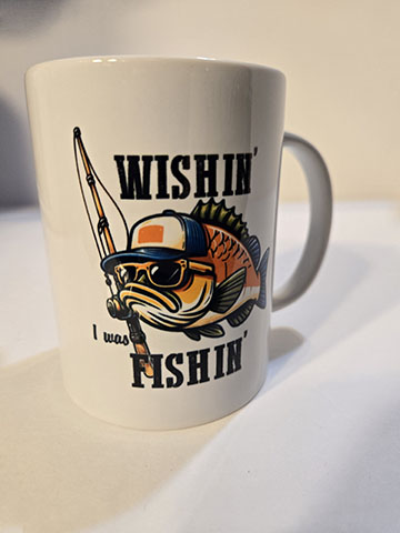 15oz ceramic mug featuring a wishin I was fishin design