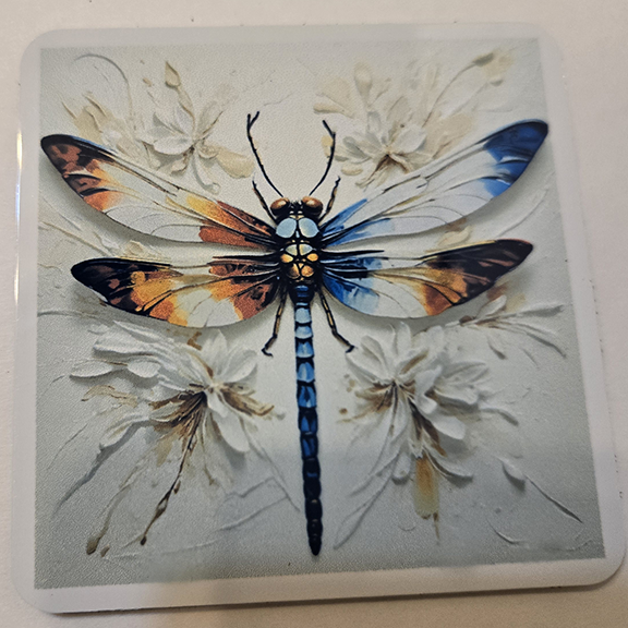 Square metal coaster with a painted dragonfly design