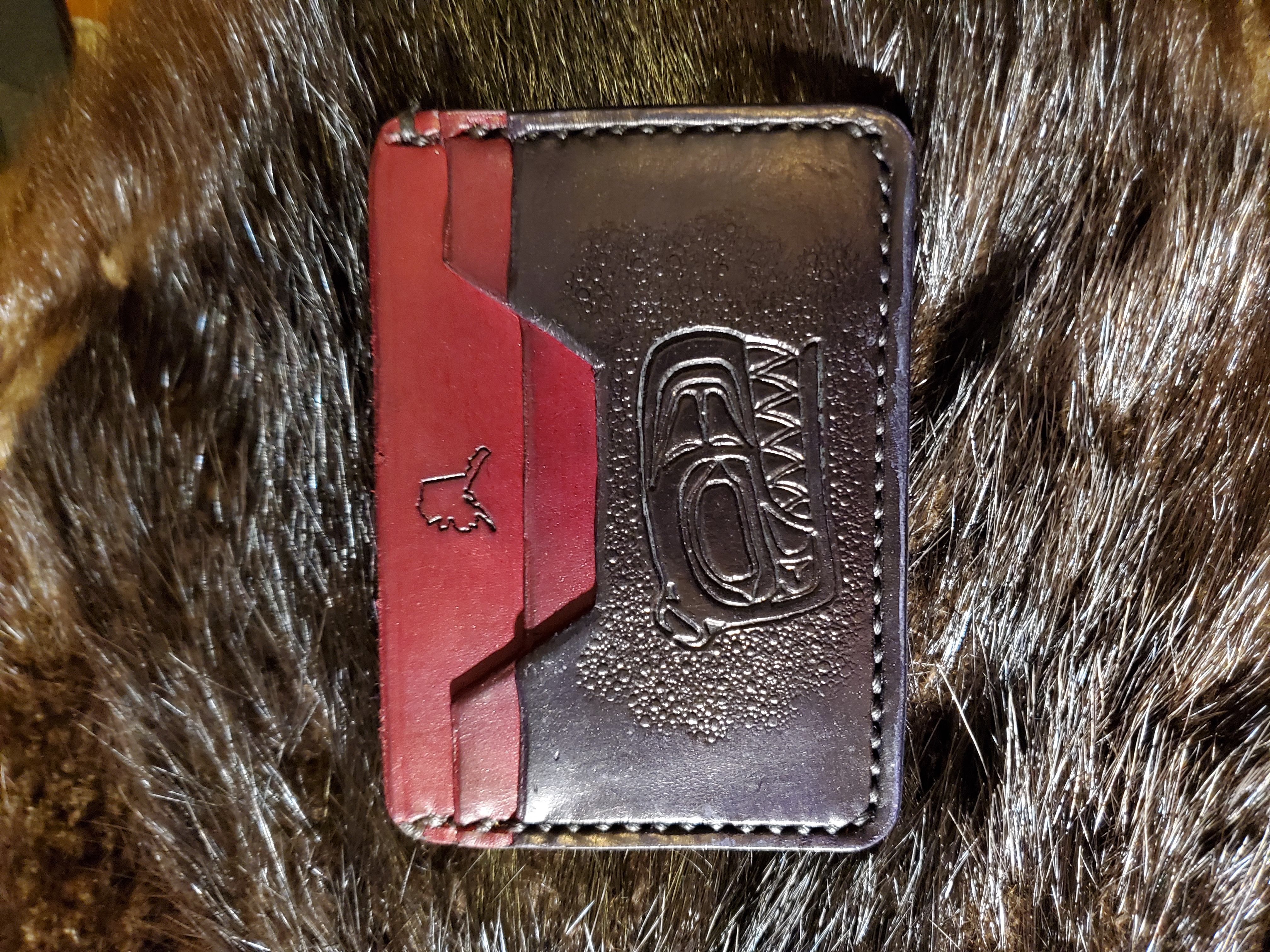 (Front)  3 pocket minimalist wallet, Native Killer Whale, hand stitched and tooled,  $65.00