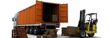 Office chair in front of stack of cardboard boxes