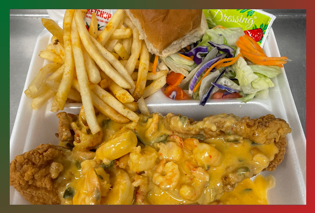 A plate full of french fries, and catfish