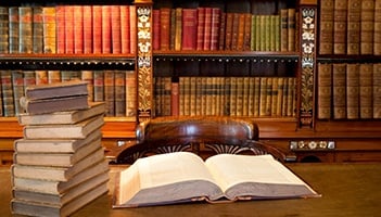 Old Classic Library With Books On Table