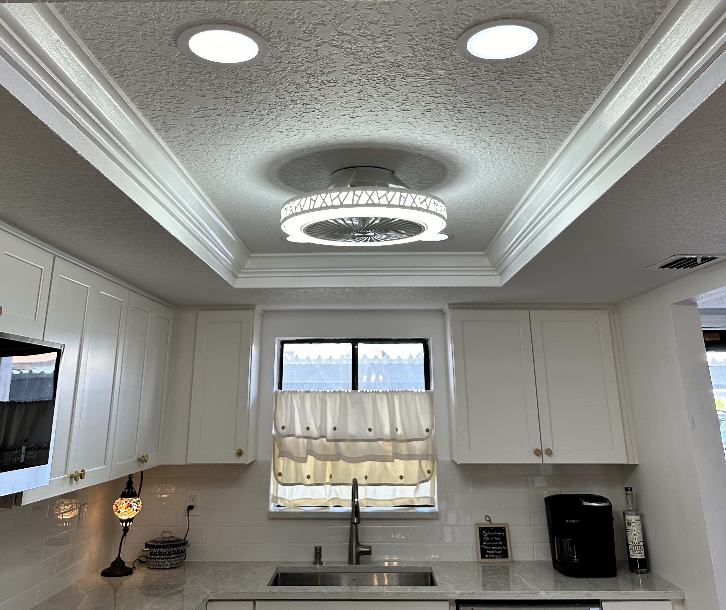 The lighted bladeless fan fits this kitchen ceiling perfectly. 