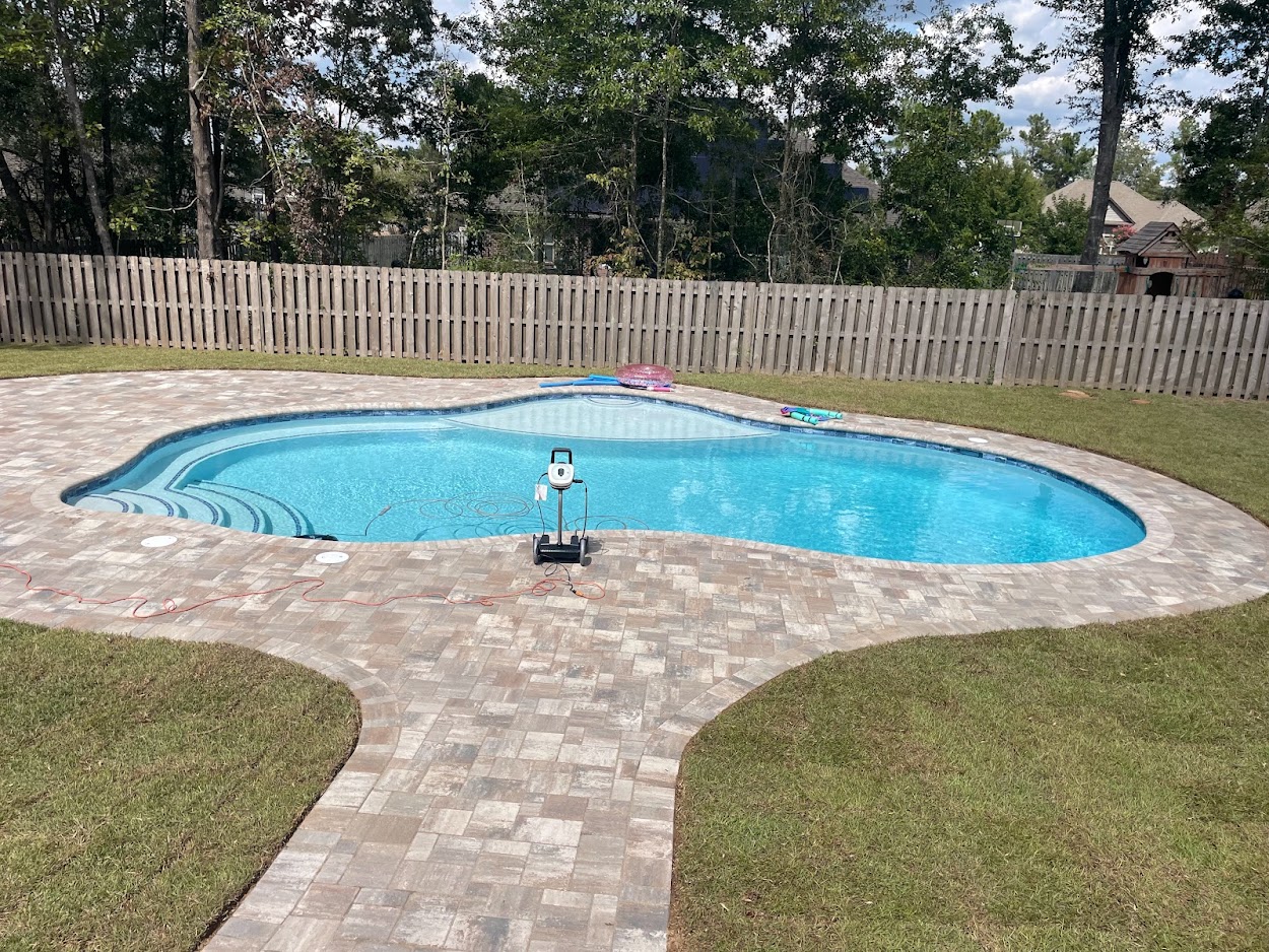 freeform gunite with paver coping and deck