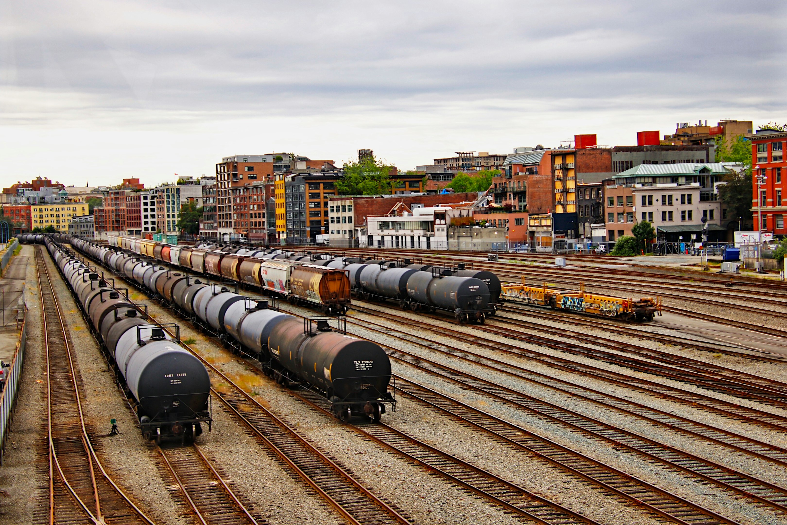 black train on rail road during daytime
