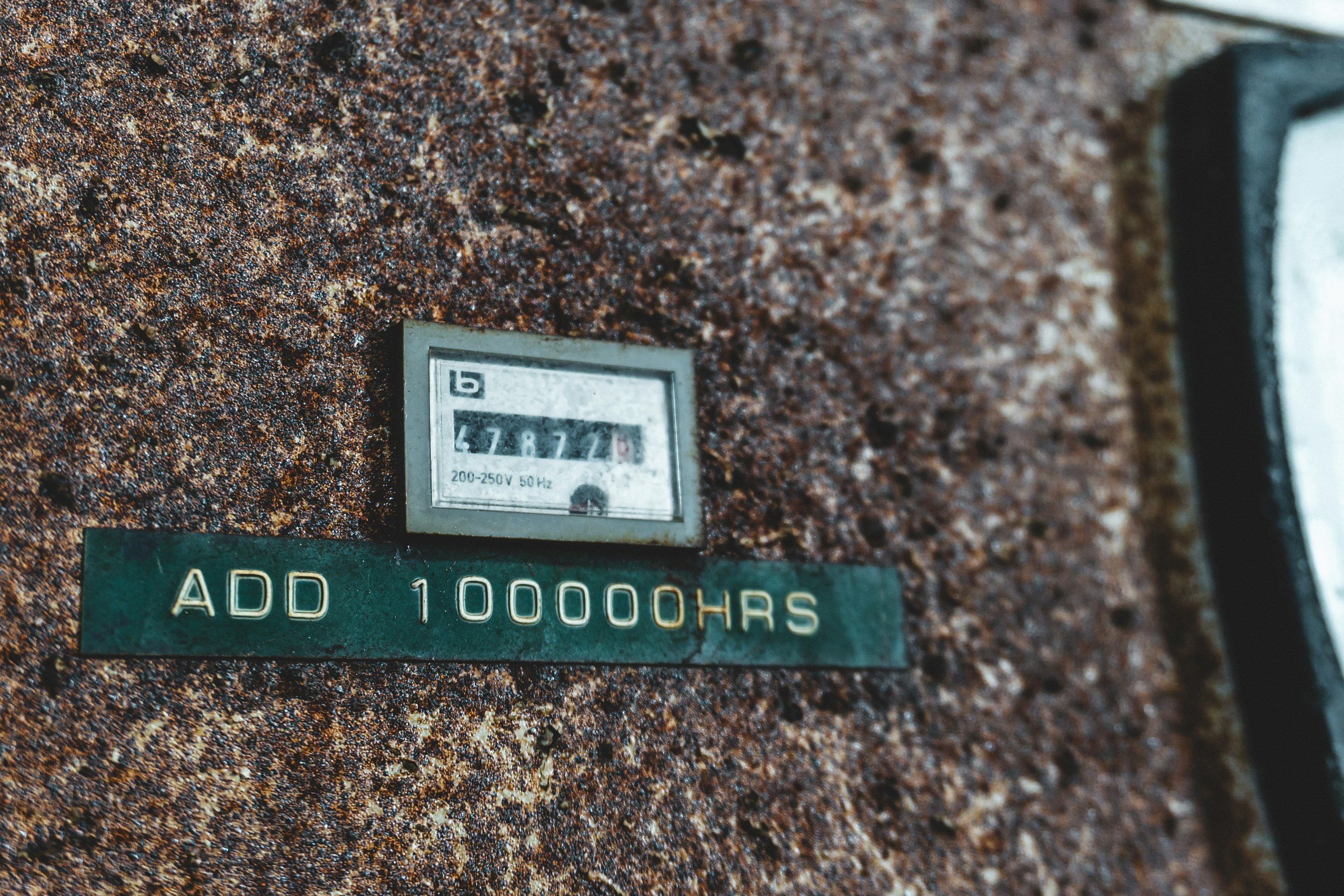 a close up of a street sign on the side of a building