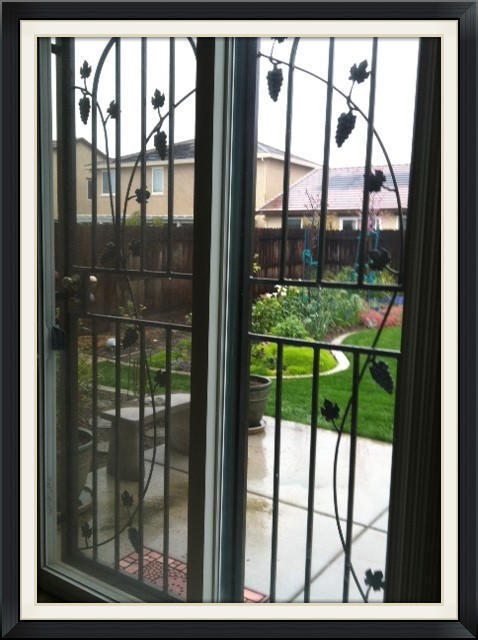 Patio door guard with vines, grapes and leaves
