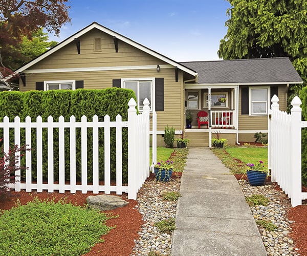 House Exterior With White Wooden Fence