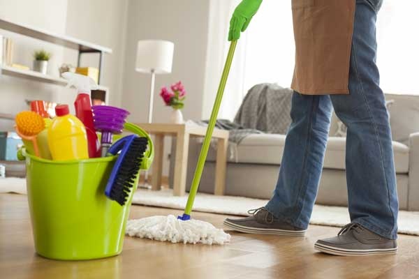 Man Holding Mop And Plastic Bucket