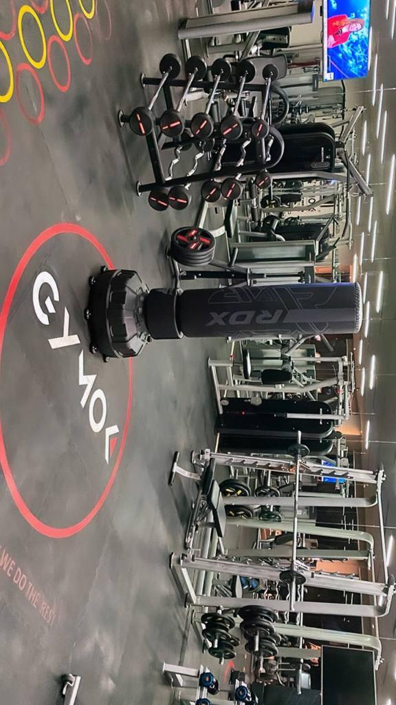 Young athletic man exercising in the rain