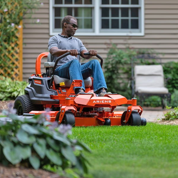 A Man Using an Ariens Lawn Mower