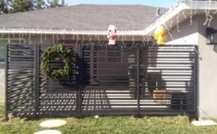 Wrought iron fence around a back patio front view.