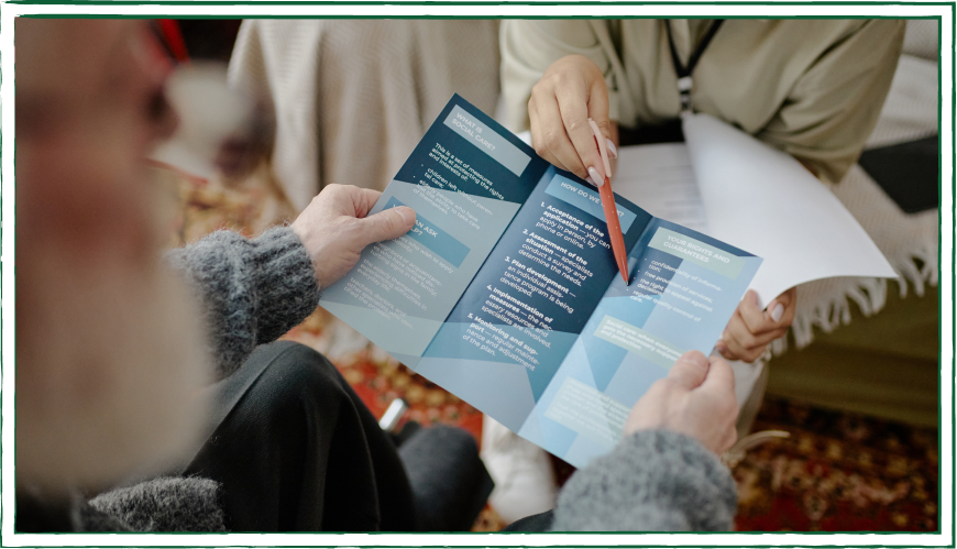 A woman reading a printed document A woman reading a printed document