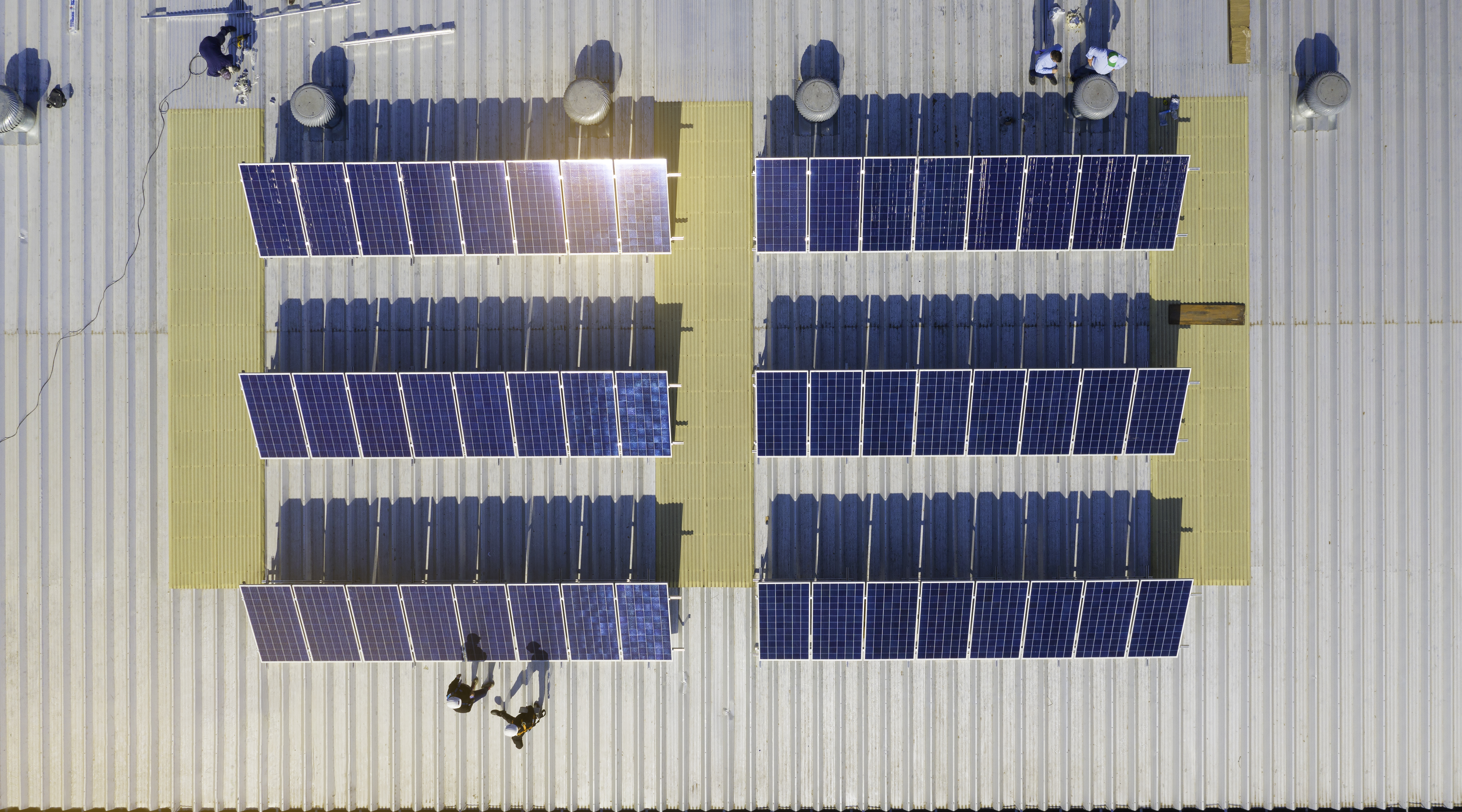 https://0201.nccdn.net/1_2/000/000/09f/597/solar-panels-installation-in-process-drone-image.jpg