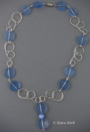https://0201.nccdn.net/1_2/000/000/0a2/785/SS-Circle---Blue-Bead-Necklace-2-4x6-288x422.jpg