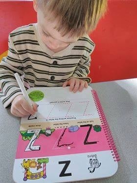 Boy Tracing Letters