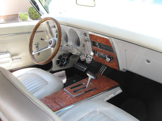 New door panels, carpet, and the dash was painted pearl white.