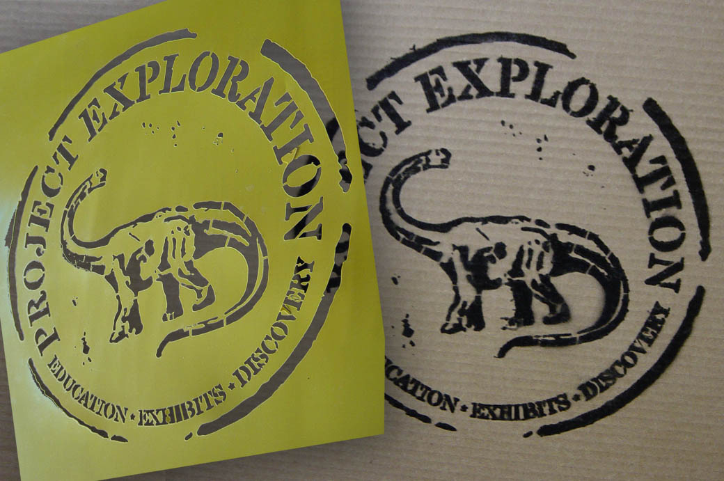 flexible yellow stencil sample showing detailed  circular logo with text and image