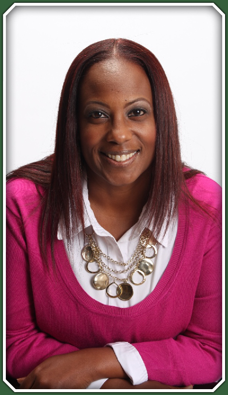 A photo of the business owner in a pink sweater