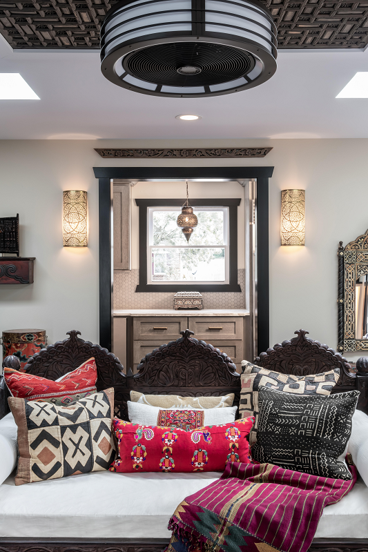Moroccan Daybed, pierced sconces and pendant light, and carved ceiling panel