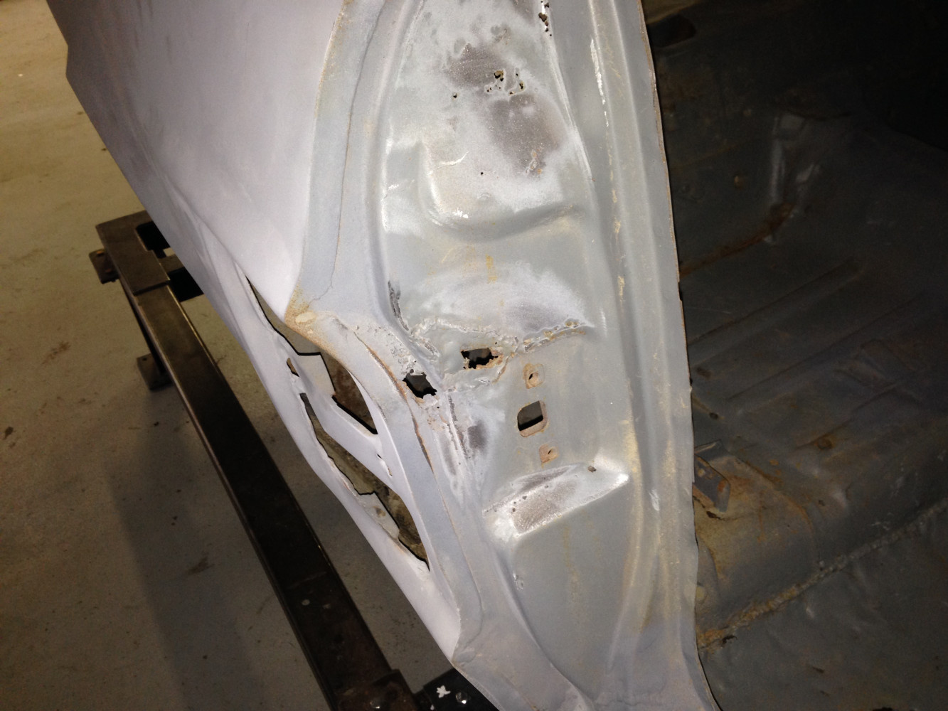 Even both door jabs are rusted.