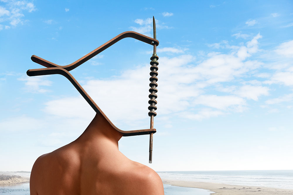 Salvador Dali inspired image of a woman at the ocean with a head made out of metal bars and mechanical parts, forming a vaguely fish-like form. 