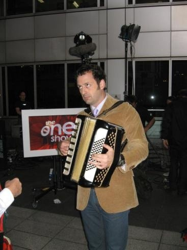 TV presenter Matt Allwright trying to play the accordion