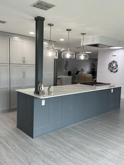 Lovely kitchen featuring beautifully installed Alaskan Hill LVP. 