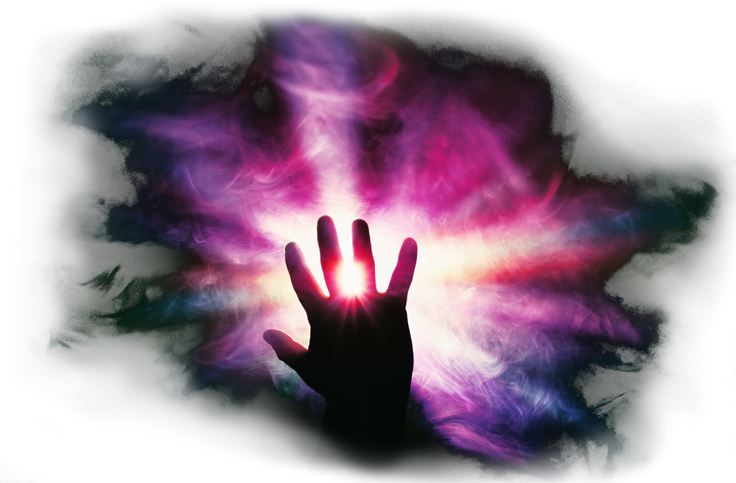 Hand over an abstract background of colors.