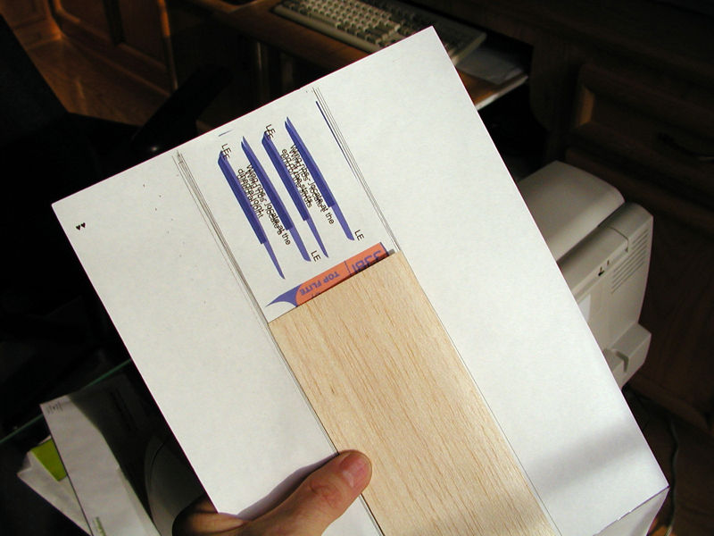 Once you have a backing sheet created with a copy of your graphic printed as a guide, align a sheet of balsa in the middle of the target printing path.