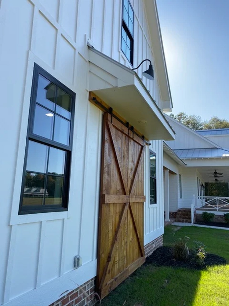 barn door on white building