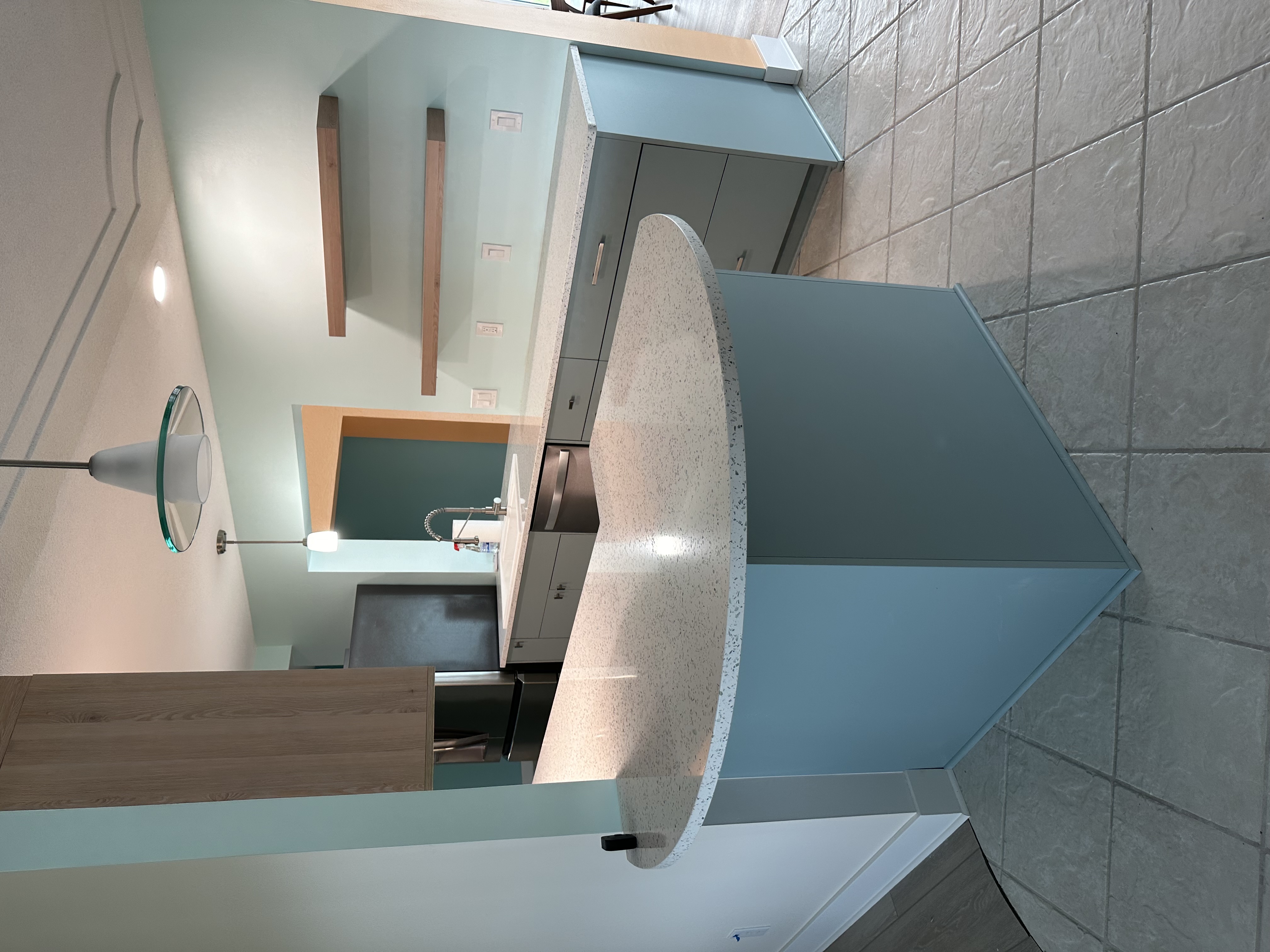 The Curava recycled glass countertop adds dimension to this charming kitchen.