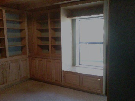These office cabinets feature raised paneled doors,
 window seat with storage underneath, cubby hole
 above window, adjustable shelves and desk. Colonial
 Maple hand wiped stain with clear coating finishes red oak wood.