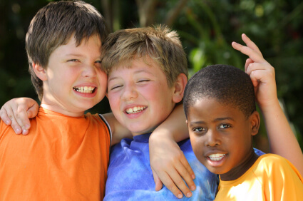 Three little boys smiling