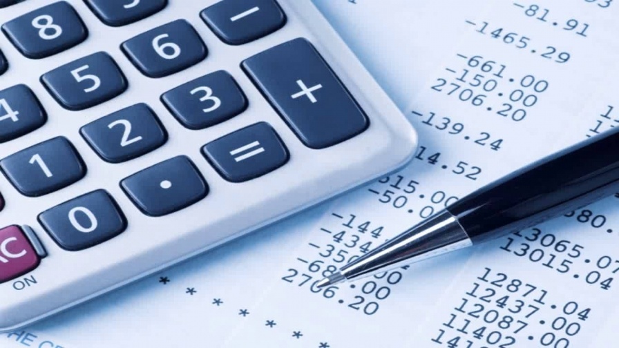 Woman working with a financial managing application on a tablet