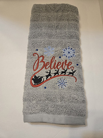 Gray hand towel featuring believe in Santa design