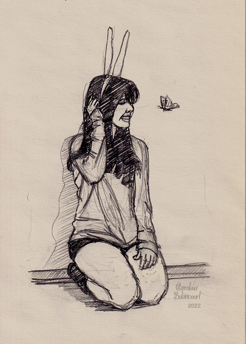 Chica sentada en el piso con diadema con orejas de conejo y una mariposa