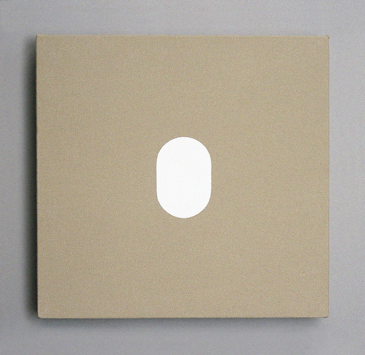 A taupe canvas square with a hard-edge white oval painted in the center.