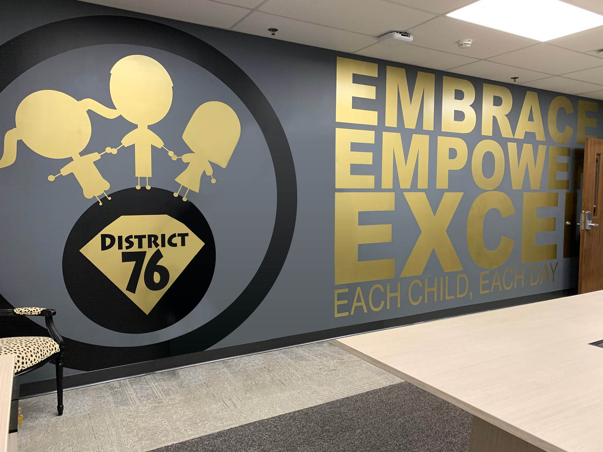 large gold and black wall graphics painted using paint mask stencils