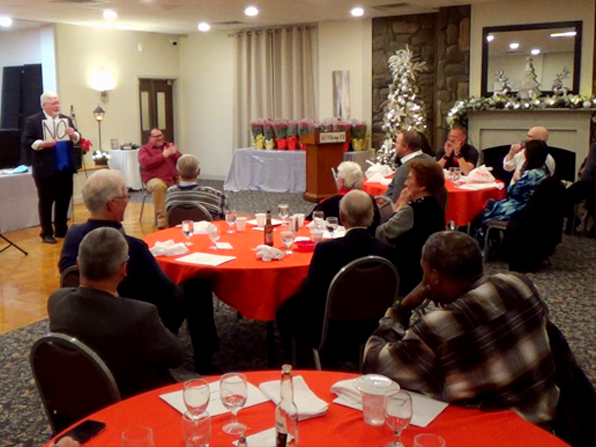 Chuck performing at a corporate holiday party for about 80 people (not all of them are in the photo.) Chuck performing at a corporate holiday party for about 80 people (not all of them are in the photo.)