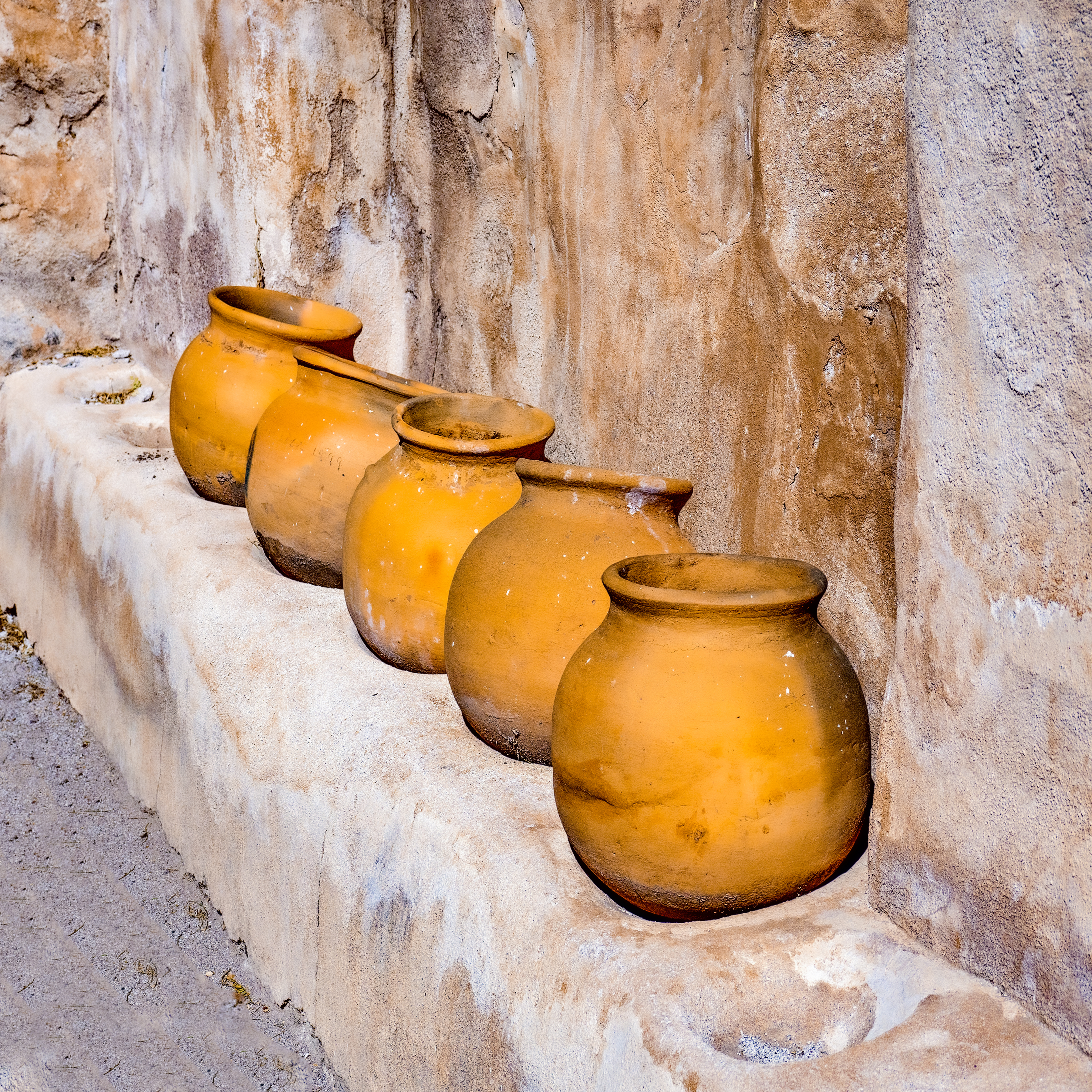 FIVE CLAY POTS - I came upon this row of clay pots in a back room of an old mission building south of Tucson. At the time, I lived in the mid-west, and a photo of clay pots in a old mission wasn't what people there were looking for. Now that I live in the southwest, it fits right in.