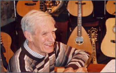 Construction worker measuring with a tape measure