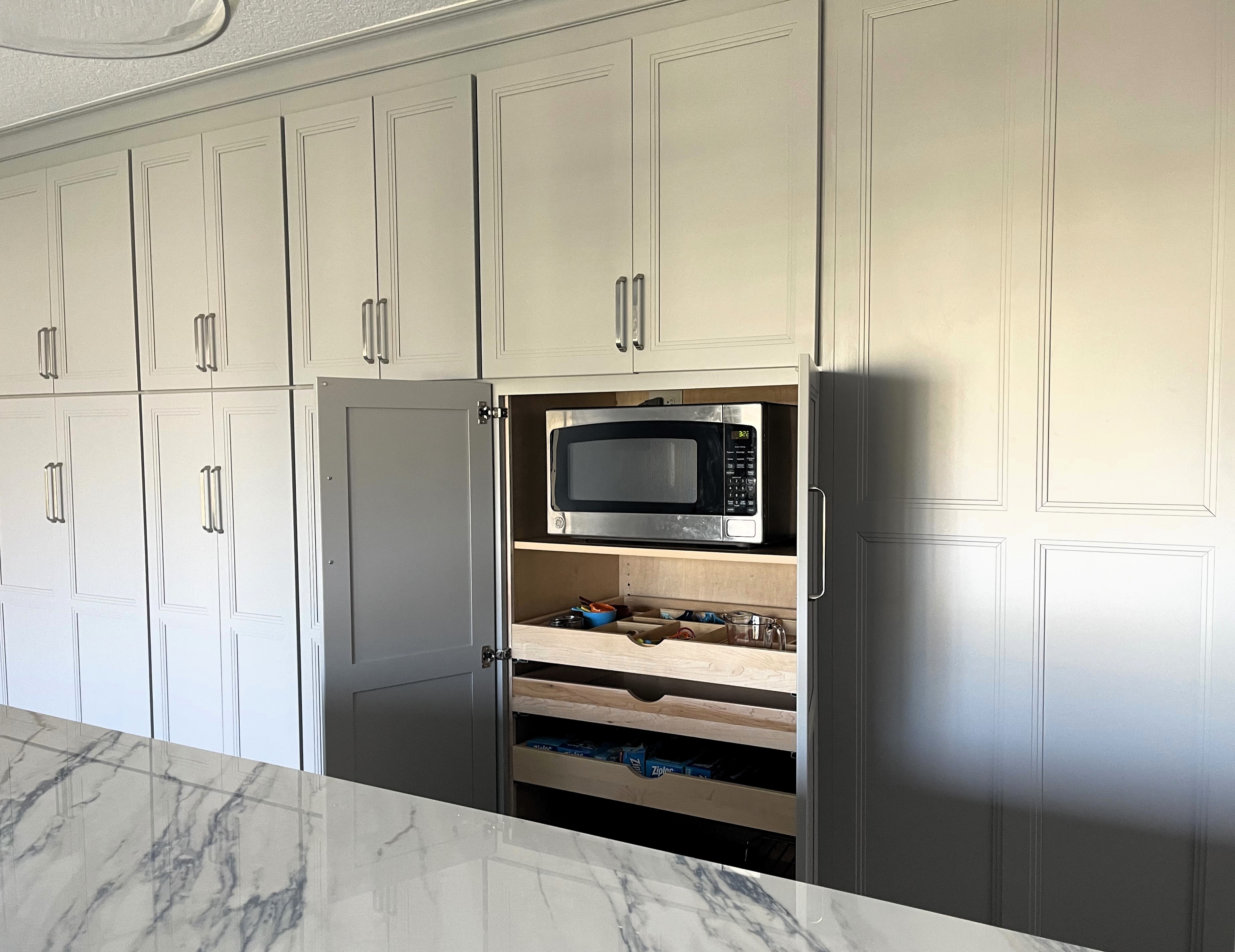 Large panties with rollouts provide plenty of storage for all kitchen items.