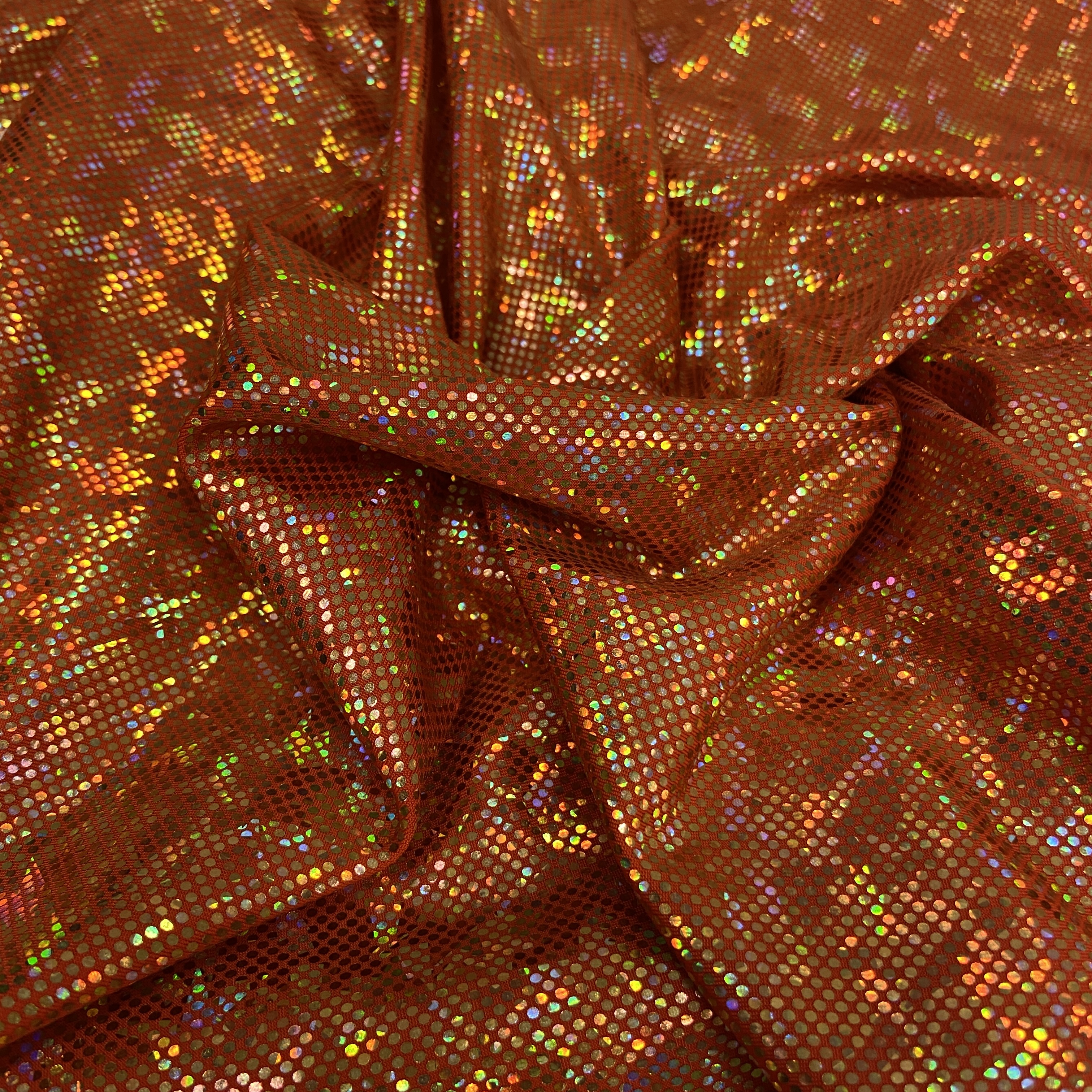 Gold shattered hologram on dark orange 